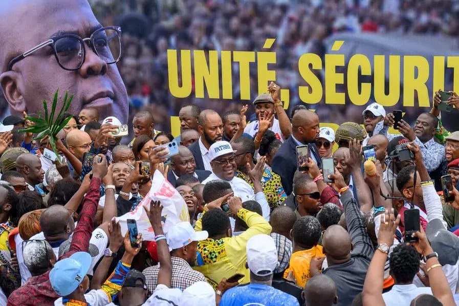 Tshisekedi (C) greets supporters after the announcement of the election results. Photo: Arsene Mpiana / AFP