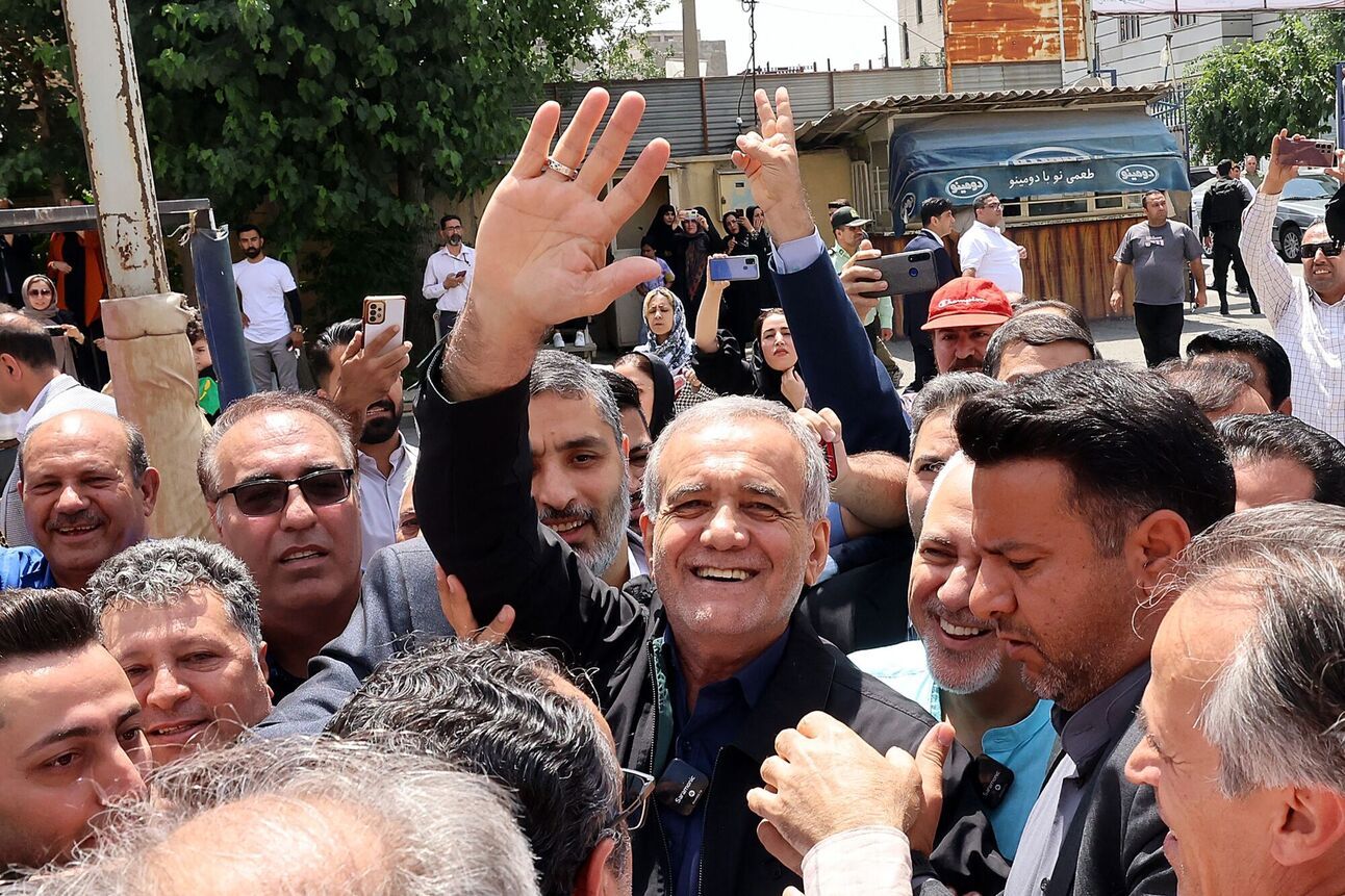 Masoud Pezeshkian surrounded by supporters outside a polling station in Tehran on July 5. Photo: Atta Kenare/AFP/Getty Images
