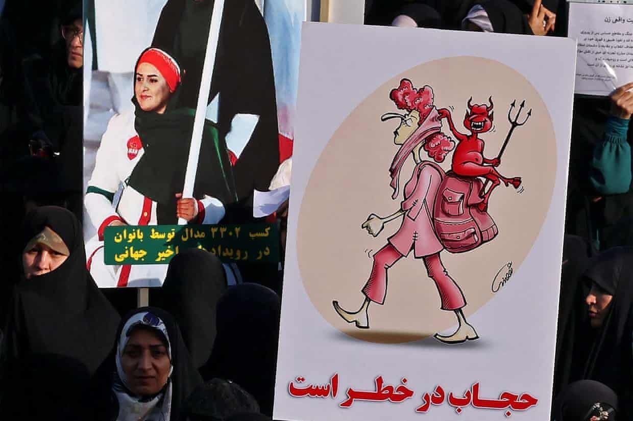 Iranian women attend a pro-hijab rally in Tehran this summer. Many others, however, are risking their lives to defy the rules. Photo: Atta Kenare/AFP/Getty Images